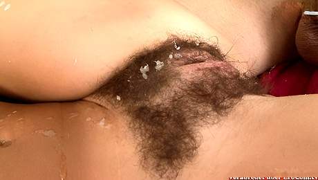 Brunette with small tits gets a cumshot on her hairy pussy
