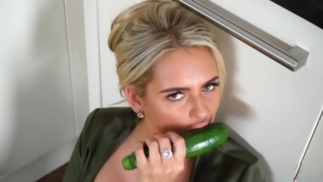 Busty blonde housewife, Katie T is masturbating with a cucumber and enjoying every second of it